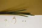 big hoop earrings and small stud earrings